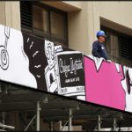 Large banner/ graphic girl with headphones in pink/ white/ black