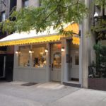 lighted yellow awning outside store