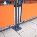 close-up of orange sidewalk barrier