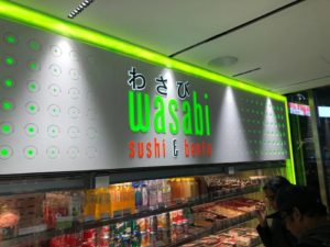 Sign for japanese restaurant in mall "Wasabi sushi & bento"