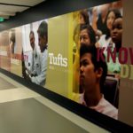 Large wall graphic for Tufts University with students and words